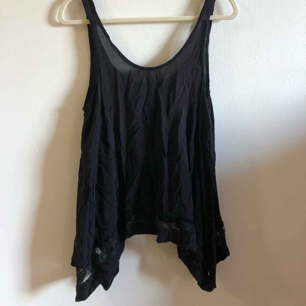 Free people top, lace trim at bottom.